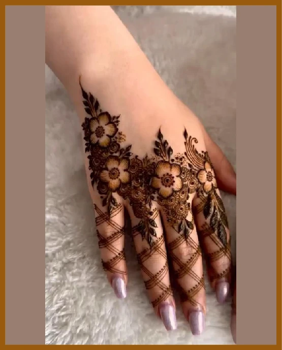 Aesthetic Back Hand Mehndi Design With Trail Ending On Fingers